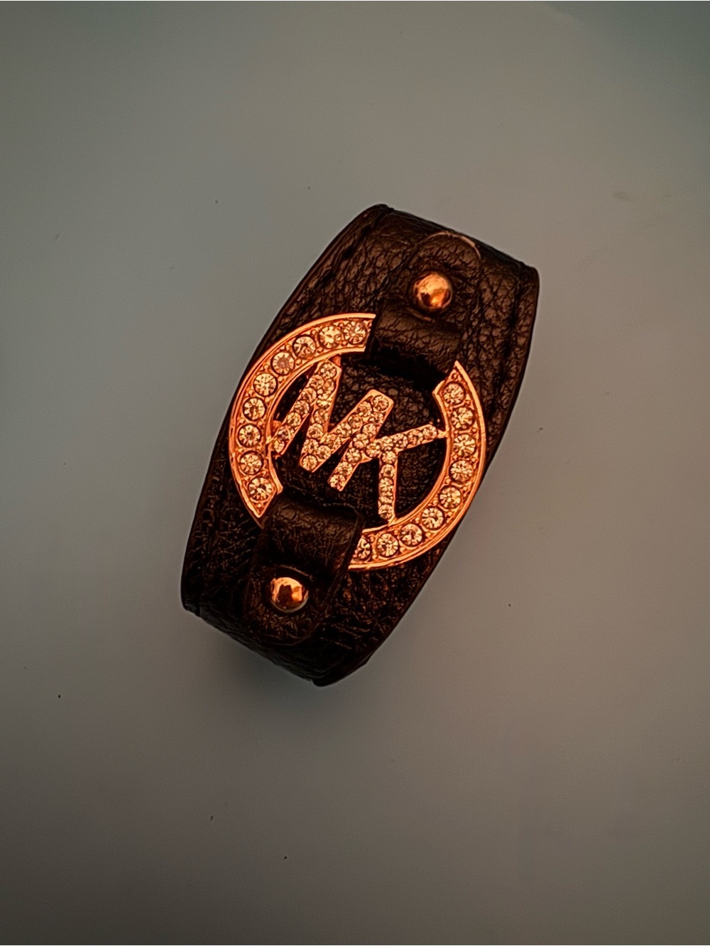 Micheal Kors leather bracelet with rhinestone logo